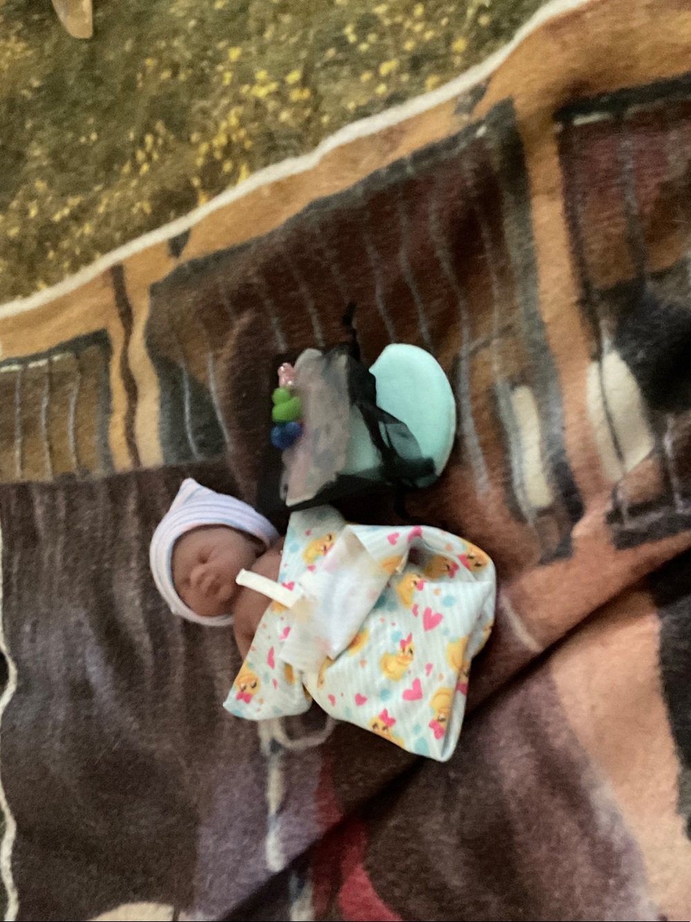 Unbranded Mini Baby Doll with Light Blue Hat and Patterned Blanket